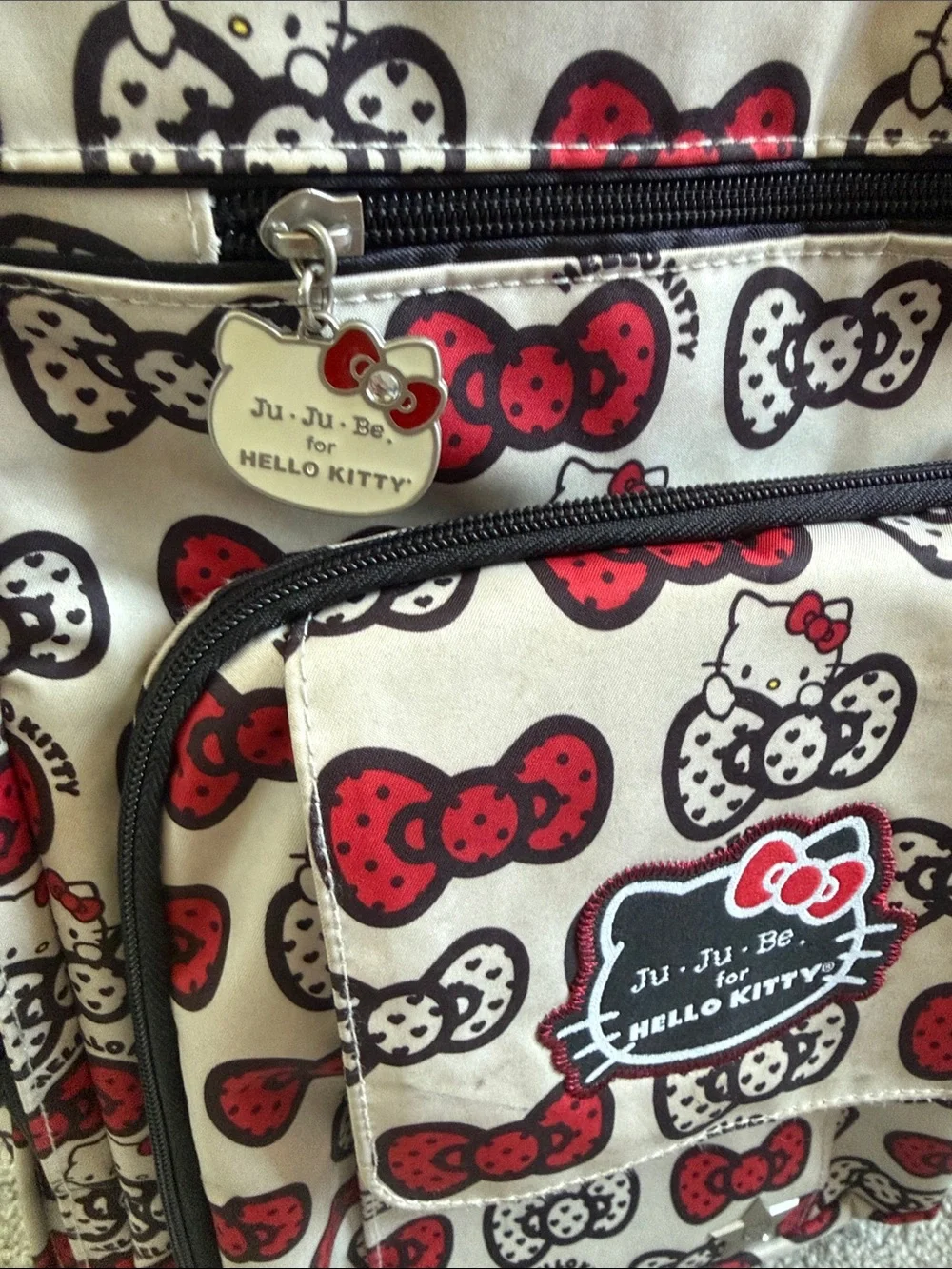 Ju-Ju-Be Hello Kitty Cream Backpack with Red & Black Bow Print
